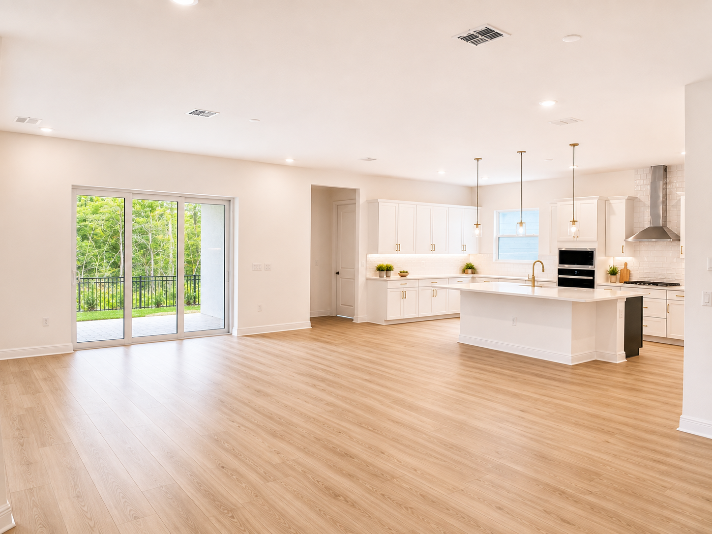Open concept living room and kitchen at 14341 Crest Palm Ave Windermere FL