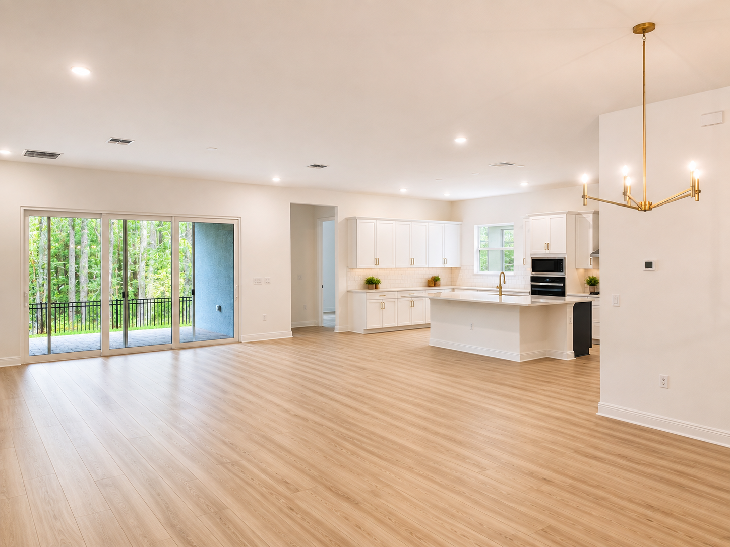 Open concept living room and kitchen at 14353 Crest Palm Ave Windermere FL