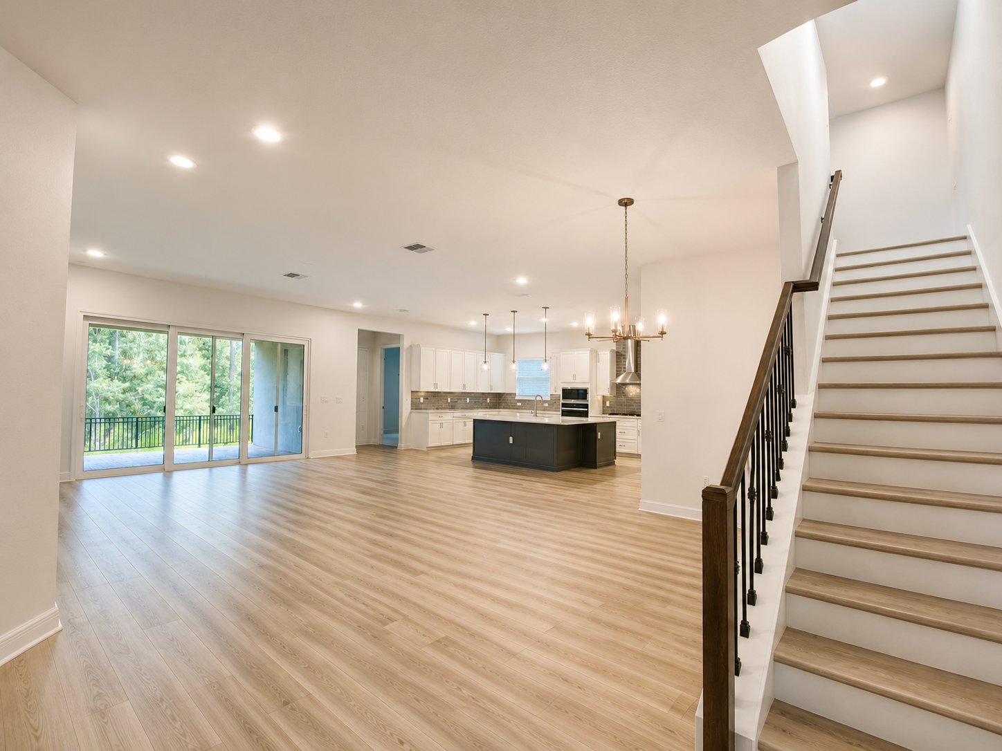 Open concept living room and kitchen at 14371 Crest Palm Ave Windermere FL